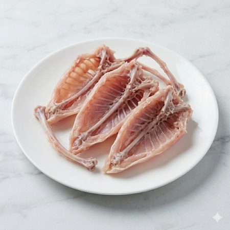 Raw bulk chicken breast frames — skeletal carcasses after breast fillets removed — Premium Poultry